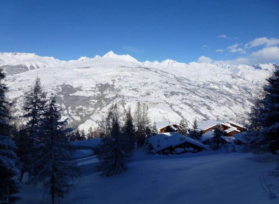 Nestled in a breathtaking snowy mountain landscape, this charming chalet offers unparalleled views and serene ambiance.
