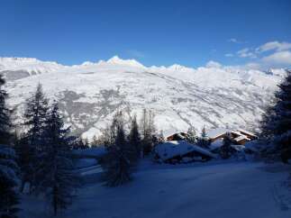 Nestled in a breathtaking snowy mountain landscape, this charming chalet offers unparalleled views and serene ambiance.