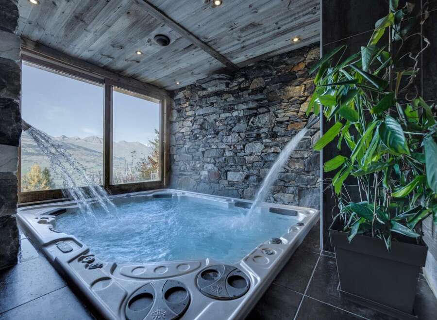Luxury chalet with stunning mountain views and a private hot tub.