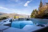 Luxury mountain getaway with stunning views and a private hot tub.