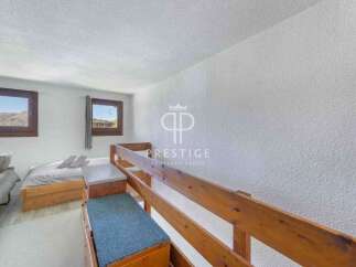 Discover a cozy bedroom with a unique bunk bed design, perfect for maximizing space.