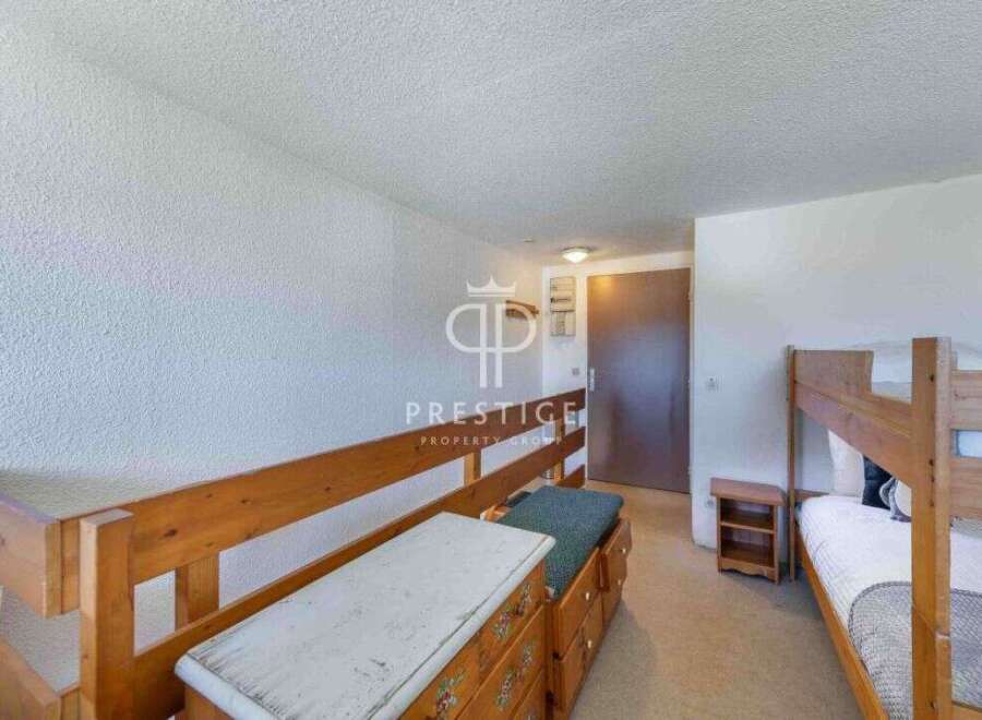 Discover a cozy bedroom with bunk beds, perfect for accommodating guests or family.