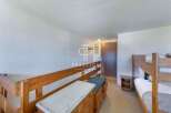 Discover a cozy bedroom with bunk beds, perfect for accommodating guests or family.