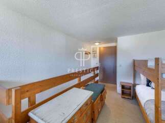 Discover a cozy bedroom with bunk beds, perfect for accommodating guests or family.