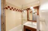 Discover a stylish bathroom featuring a sleek glass shower screen and a modern vanity.
