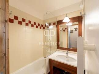 Discover a stylish bathroom featuring a sleek glass shower screen and a modern vanity.