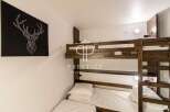 Cozy bunk beds offer a comfortable sleeping arrangement, perfect for families or groups.