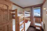 Cozy bunk beds offer a comfortable sleeping arrangement, perfect for families or groups.