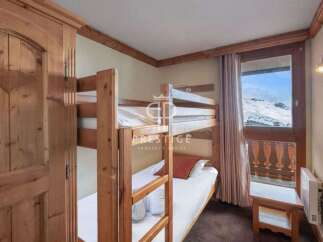Cozy bunk beds offer a comfortable sleeping arrangement, perfect for families or groups.