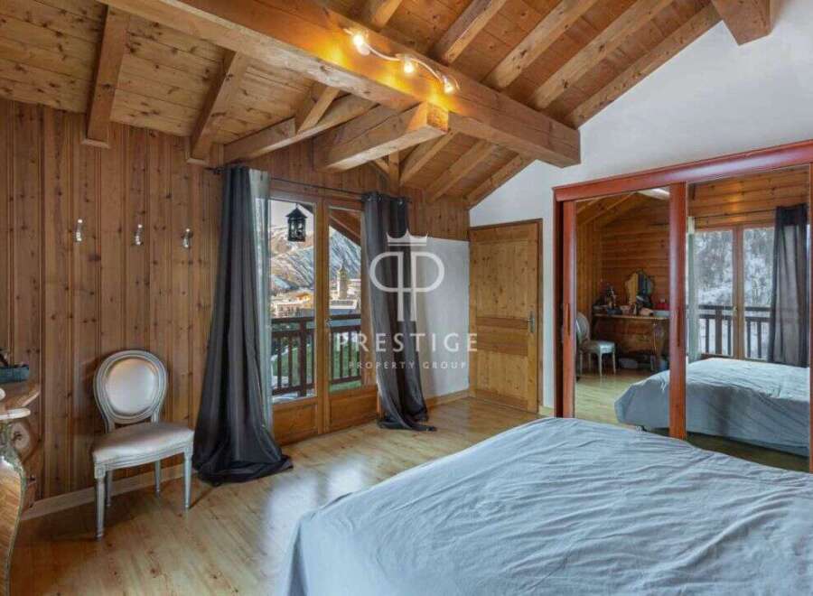 Discover the charm of this stunning property, featuring exquisite wooden interiors and a cozy ambiance.