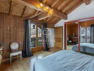 Discover the charm of this stunning property, featuring exquisite wooden interiors and a cozy ambiance.