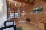 Experience the charm of this cozy wooden chalet, perfect for a mountain getaway.