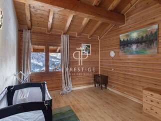 Experience the charm of this cozy wooden chalet, perfect for a mountain getaway.