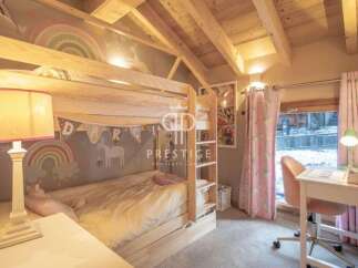 Charming children's bedroom featuring a cozy bunk bed with whimsical decor.