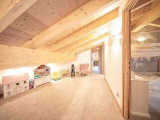 Discover the charm of this unique property, featuring a cozy loft space perfect for a children's playroom or a creative retreat.