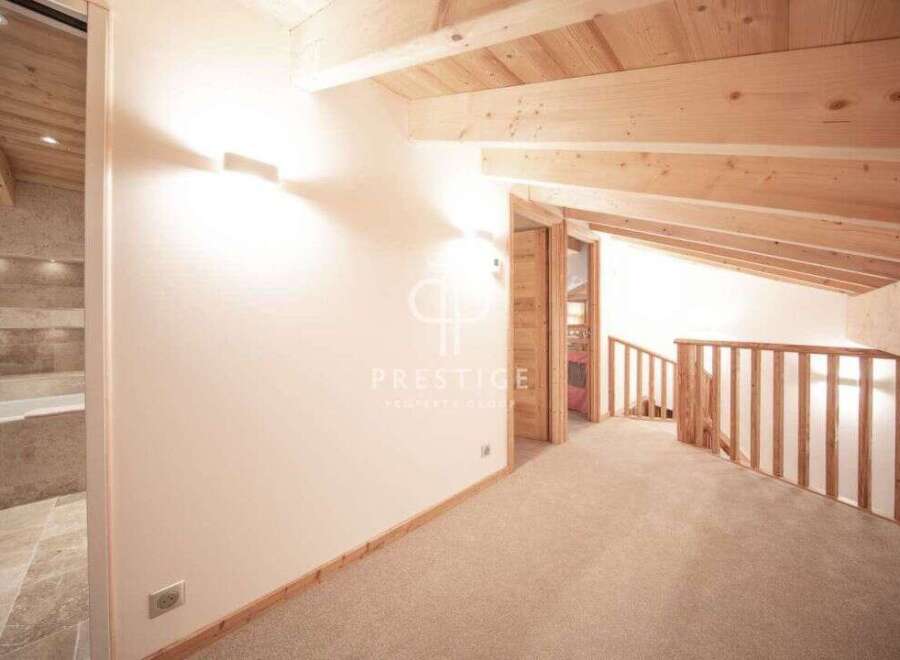 Discover the charm of this stunning property, featuring a beautifully designed interior with exposed wooden beams and a cozy ambiance.