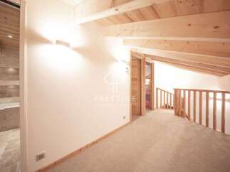Discover the charm of this stunning property, featuring a beautifully designed interior with exposed wooden beams and a cozy ambiance.