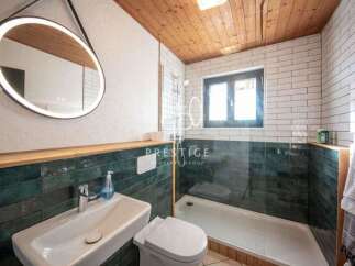 Step into this stunning bathroom, featuring a modern design with a touch of elegance.