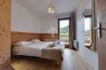 Discover a cozy bedroom with a stunning view.