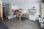 Cozy studio apartment with a modern kitchen and a breakfast bar, perfect for a couple or solo traveler.
