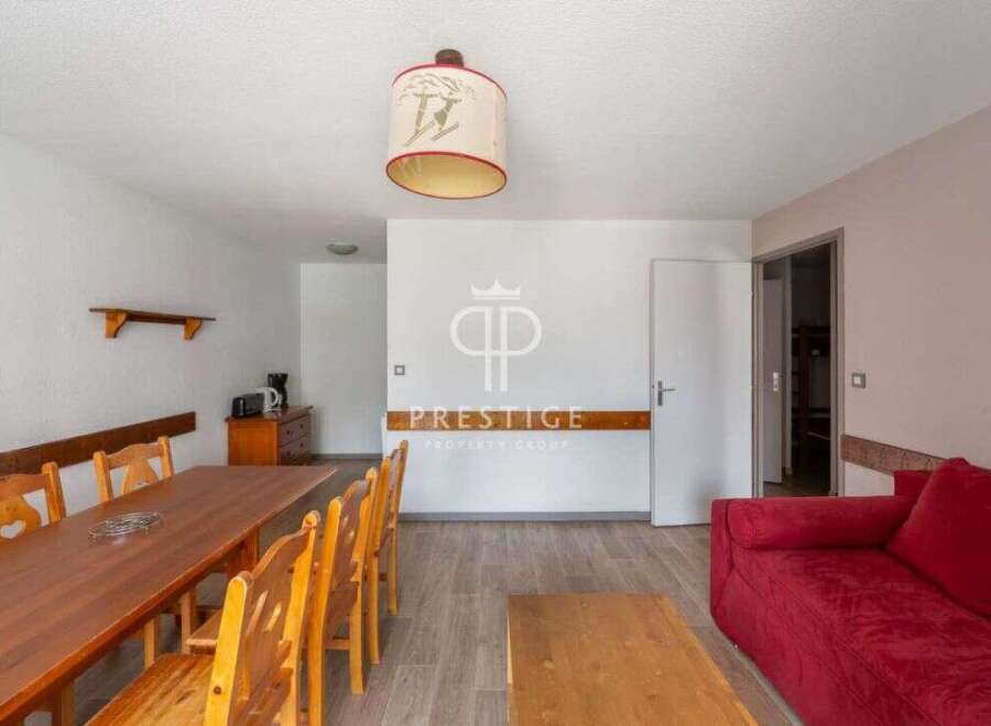 Discover a charming property with a cozy dining area, perfect for gatherings.