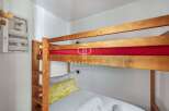 Cozy bunk beds offer a comfortable sleeping arrangement, perfect for families or groups.