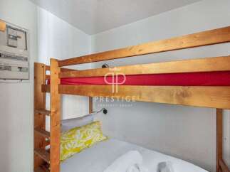 Cozy bunk beds offer a comfortable sleeping arrangement, perfect for families or groups.