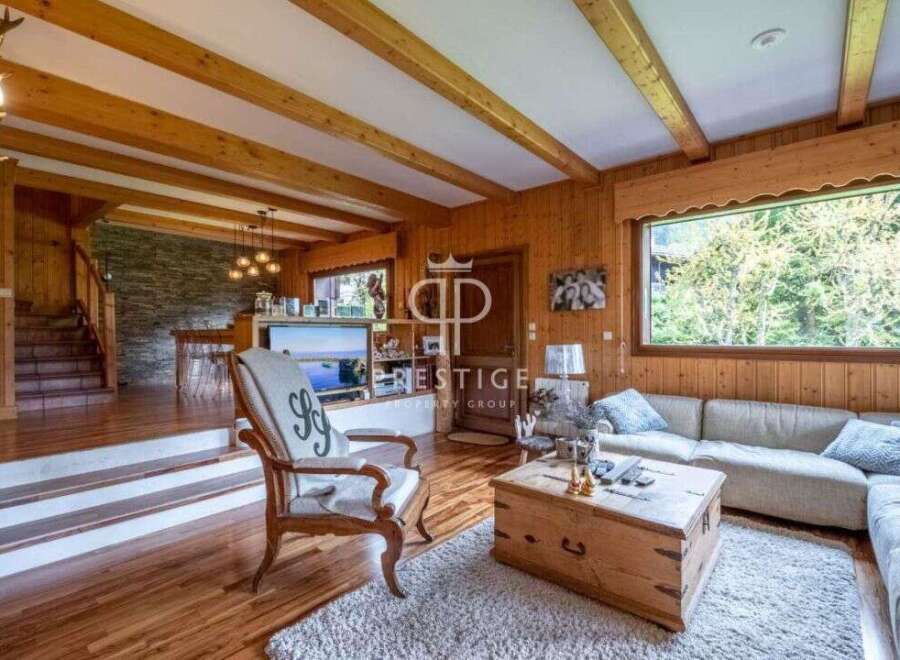 Experience the warmth of this stunning property, featuring exquisite wooden interiors and a cozy ambiance.
