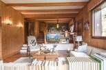 Discover the charm of this stunning property, featuring exquisite wooden paneling and a cozy ambiance.