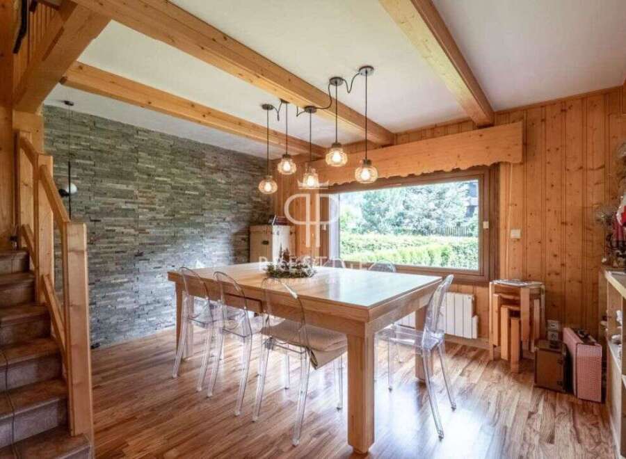 This stunning property boasts a warm and inviting dining area, perfect for gatherings.