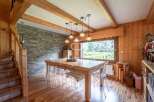 This stunning property boasts a warm and inviting dining area, perfect for gatherings.