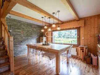 This stunning property boasts a warm and inviting dining area, perfect for gatherings.