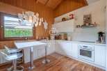 Discover a charming kitchen with a unique blend of rustic wood and modern design.