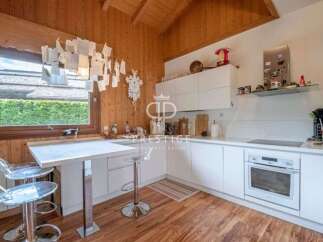 Discover a charming kitchen with a unique blend of rustic wood and modern design.