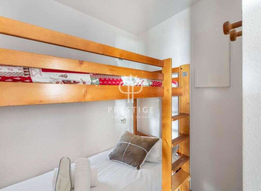 Cozy bunk beds offer a comfortable sleeping arrangement, perfect for families or groups.
