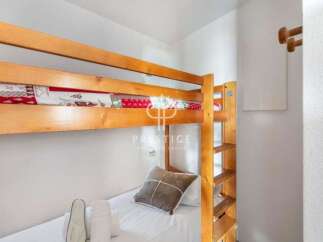 Cozy bunk beds offer a comfortable sleeping arrangement, perfect for families or groups.