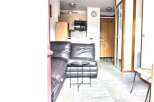 Discover this stylish property featuring a modern living space with a comfortable leather sofa.