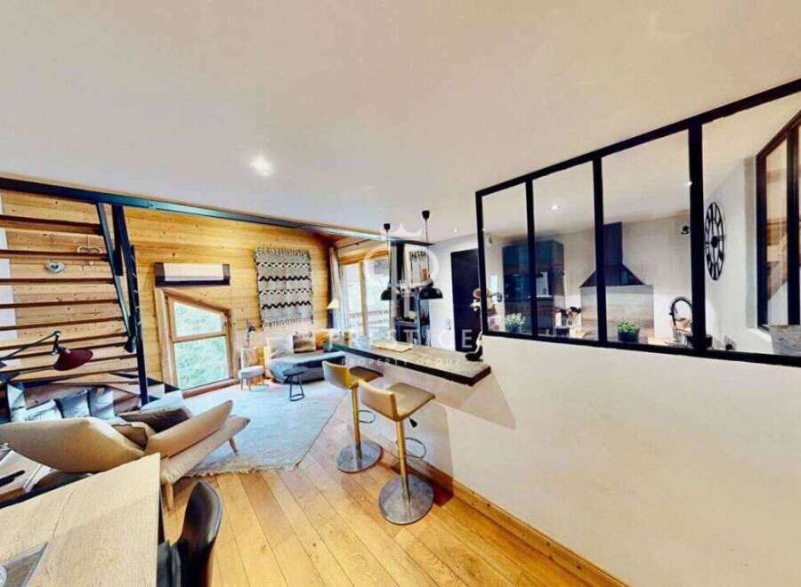 Discover this stunning property featuring a modern kitchen with sleek black accents and a stylish breakfast bar.
