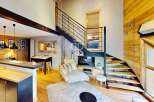 Discover a stunning property featuring a modern interior with a unique staircase design.