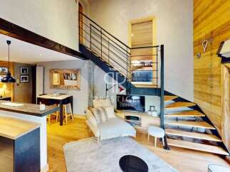 Discover a stunning property featuring a modern interior with a unique staircase design.