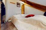 Discover a cozy bedroom with a unique architectural design.