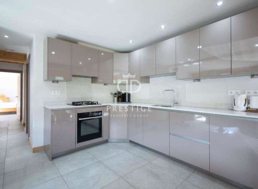 Modern kitchen design with sleek cabinetry and integrated appliances.