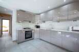 Modern kitchen design with sleek cabinetry and integrated appliances.