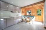Discover a stunning kitchen with modern design and ample storage.