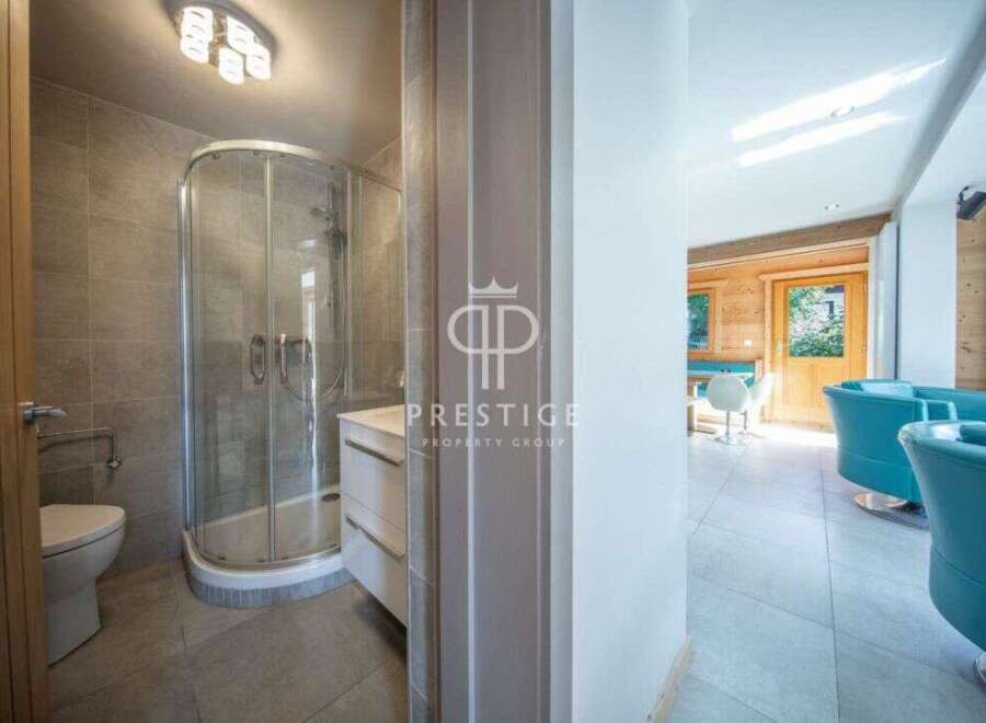 Discover luxury living in this stunning property! Featuring a modern bathroom with a sleek shower and elegant finishes.