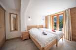 Discover a cozy bedroom with a touch of nature.