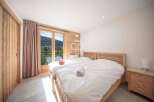 Discover a cozy bedroom with a stunning mountain view.