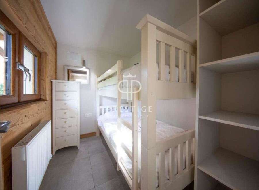 Cozy bedroom featuring a bunk bed, perfect for accommodating guests or family.