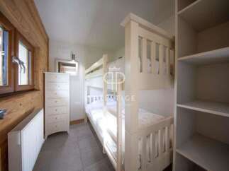 Cozy bedroom featuring a bunk bed, perfect for accommodating guests or family.