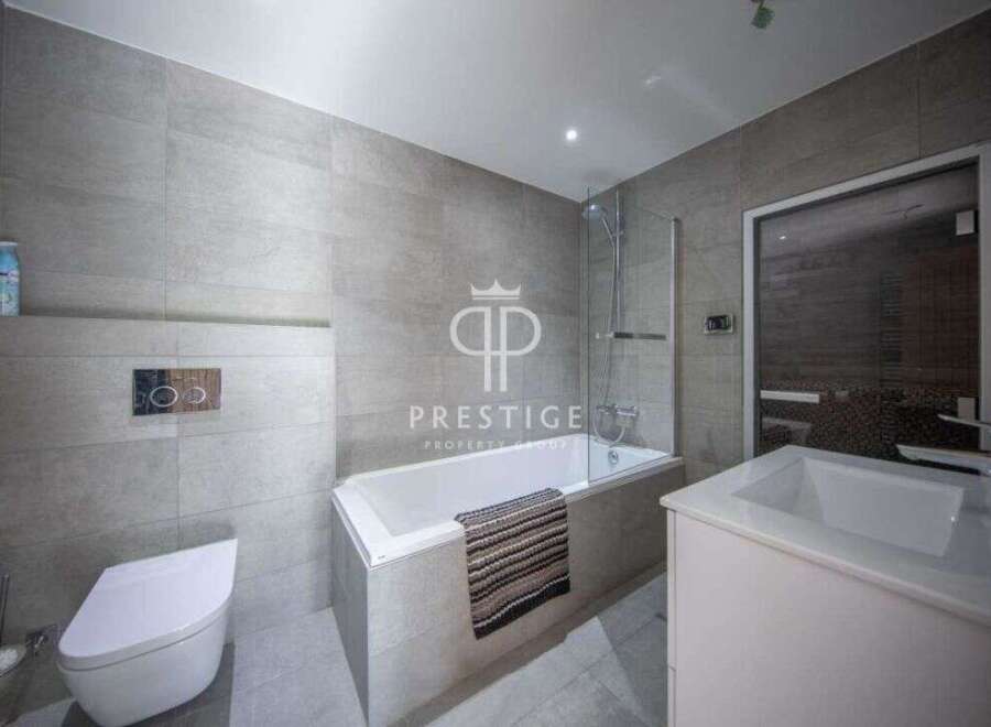 Discover luxury living in this stunning property! Featuring a modern bathroom with sleek design and high-end finishes.